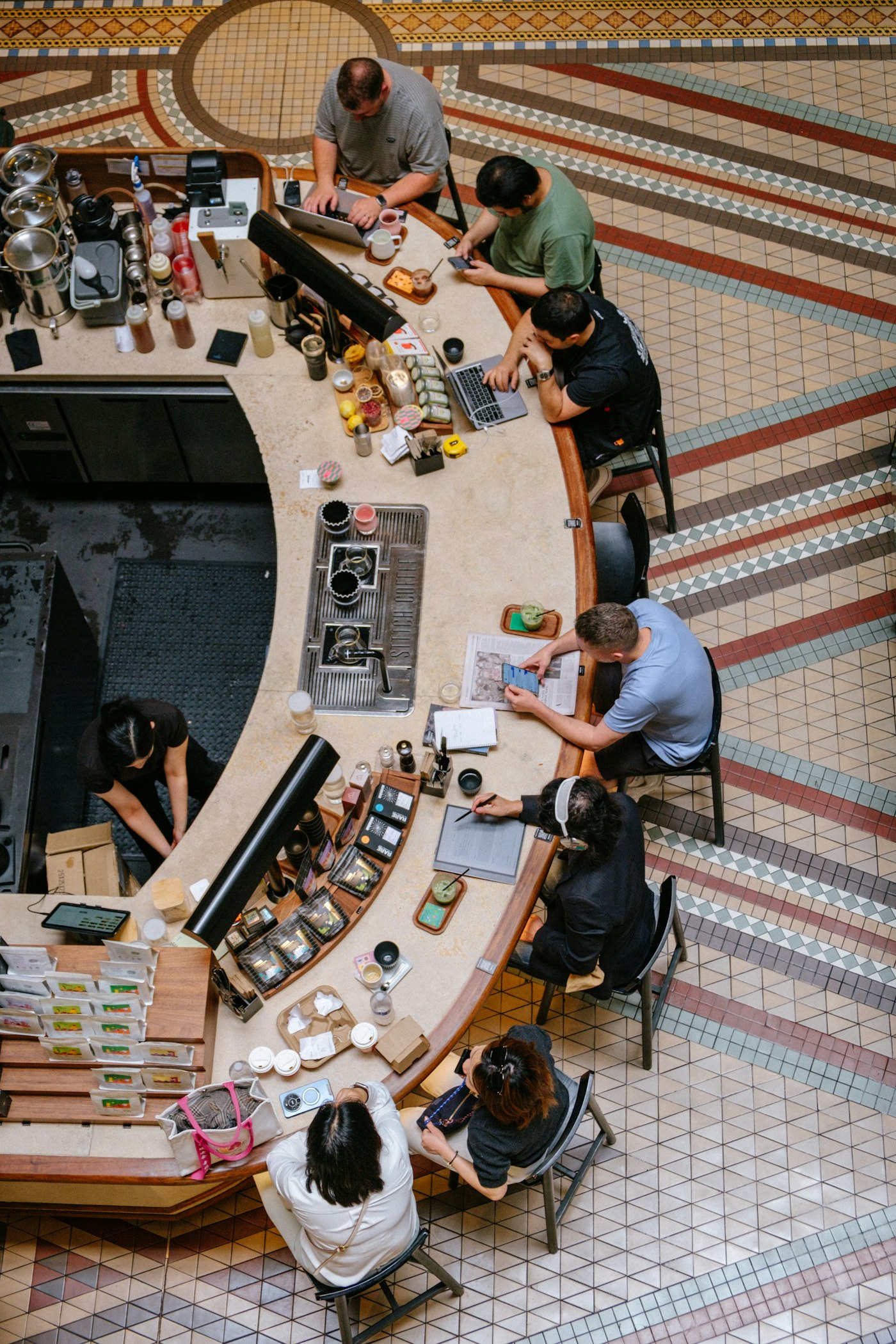 Small business owners behind their shop counter