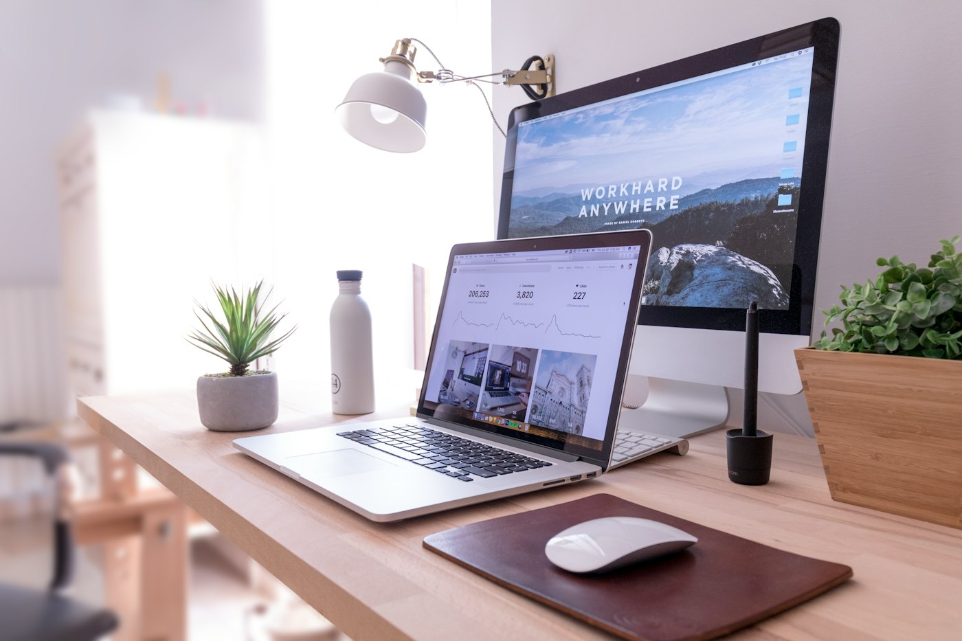 Desktop computer on a tidy desk showing a website layout