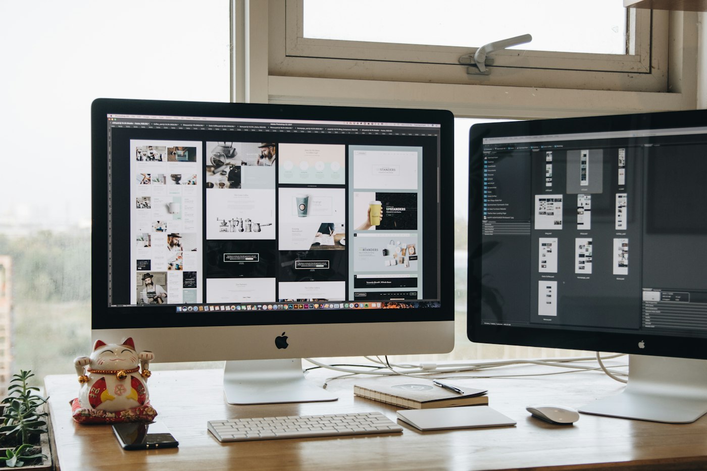 Two computer monitors on a work desk