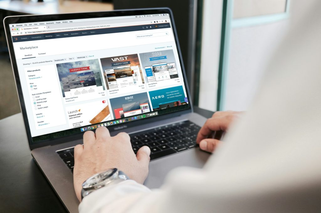 Business owner looking over a new website on a laptop
