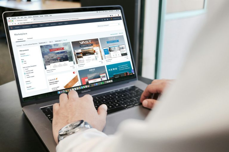 Business owner looking over a new website on a laptop