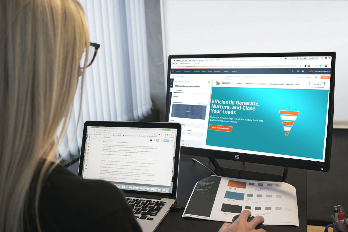 Woman working on a website at a desktop monitor